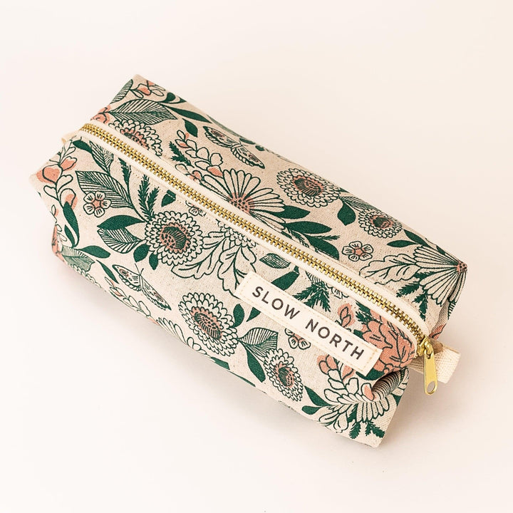 Hidden Falls pouch with outdoor-inspired print and zipper closure.