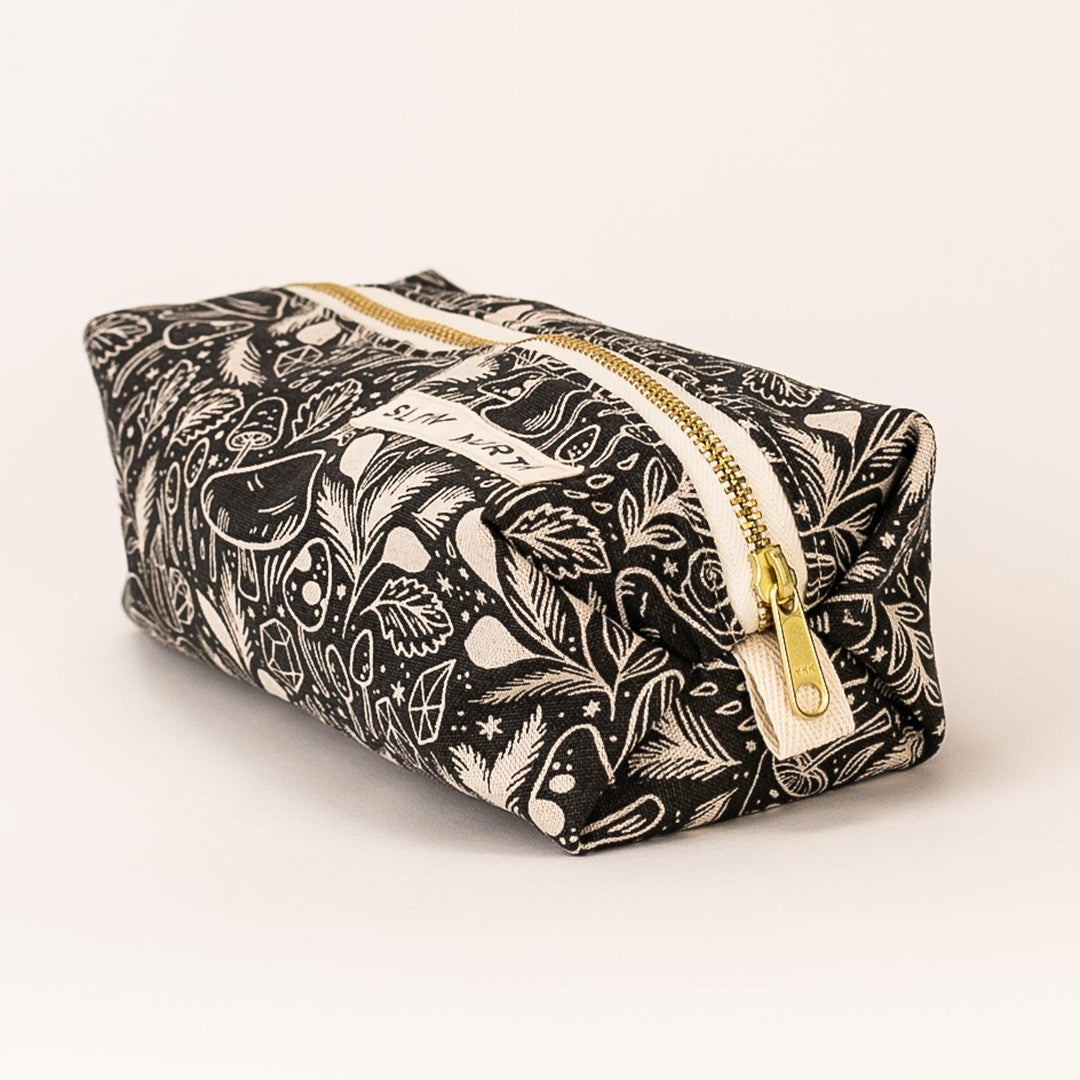 Compact Mystical Mushroom pouch with structured design for travel essentials.