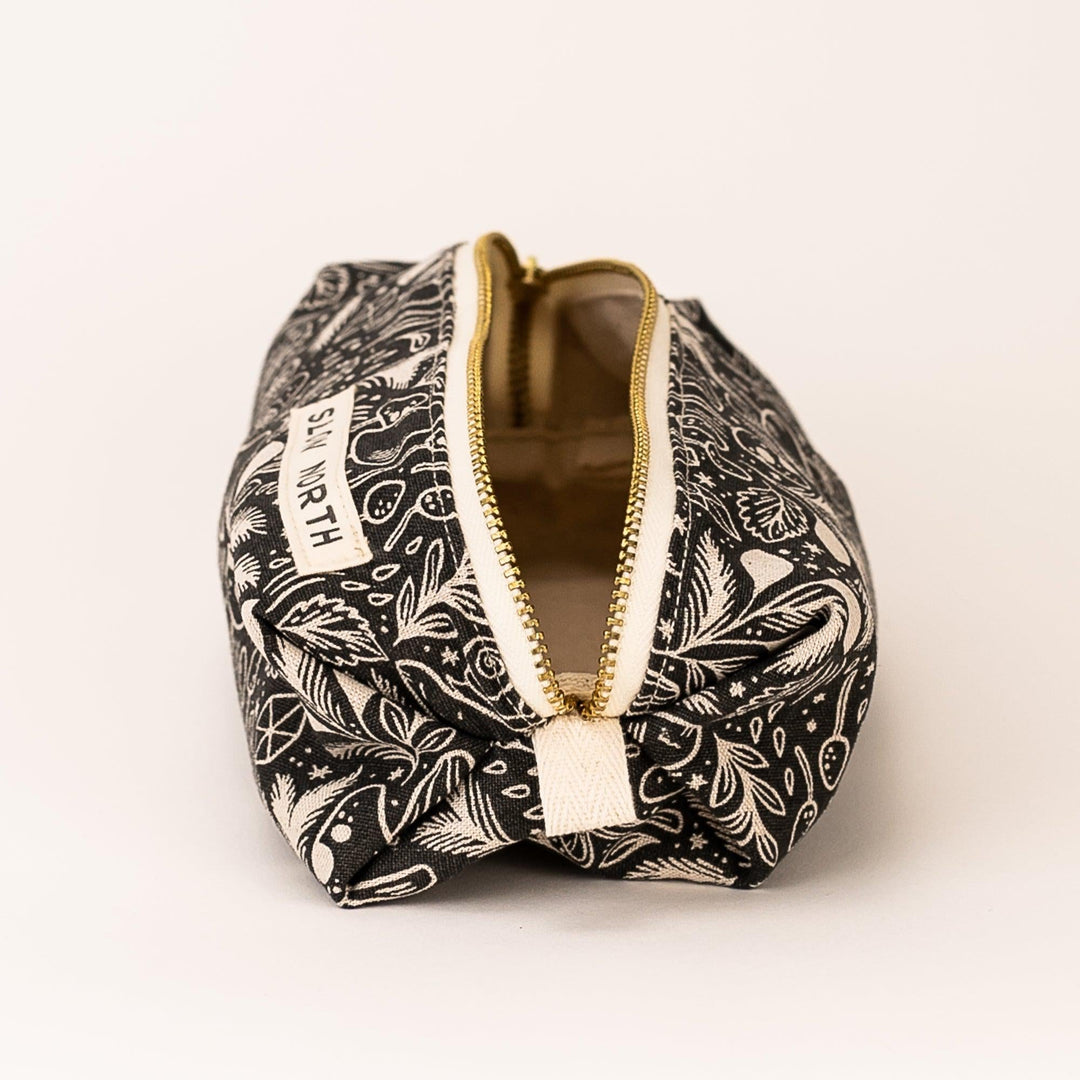Mystical Mushroom travel pouch with whimsical mushroom artwork on fabric.