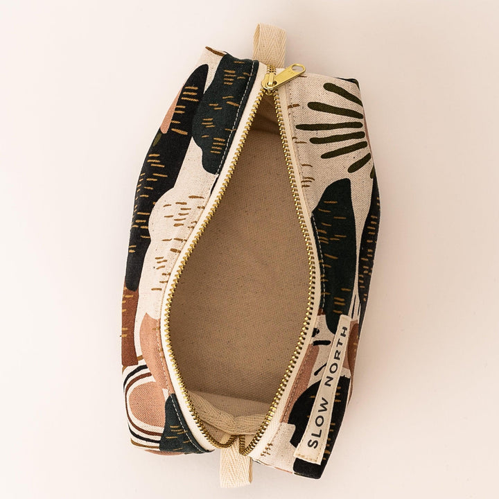 Rainbow Hill travel pouch with brass zipper and structured design.