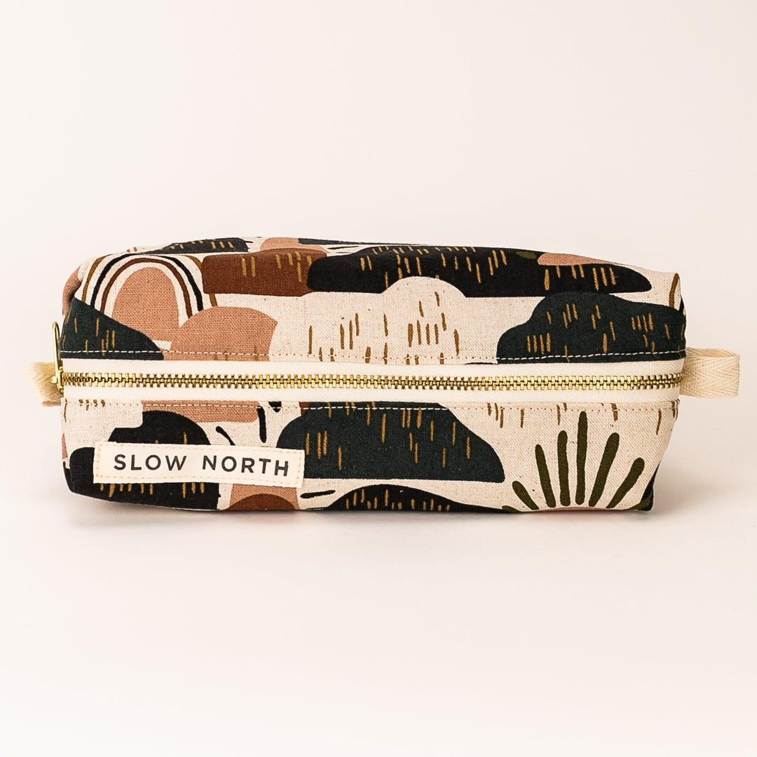 Rainbow Hill travel pouch with colorful rainbow and hills print on cotton-linen fabric.