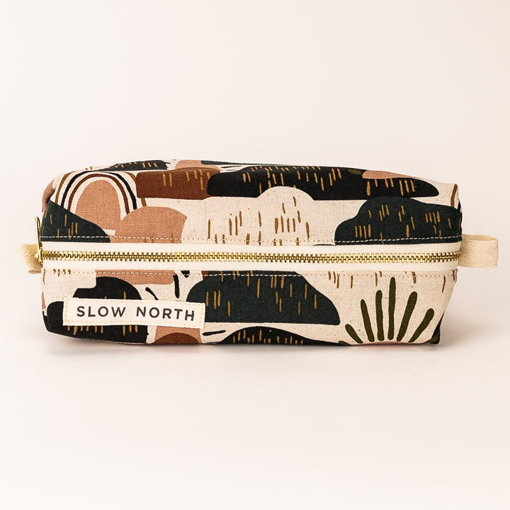 Rainbow Hill travel pouch with colorful rainbow and hills print on cotton-linen fabric.