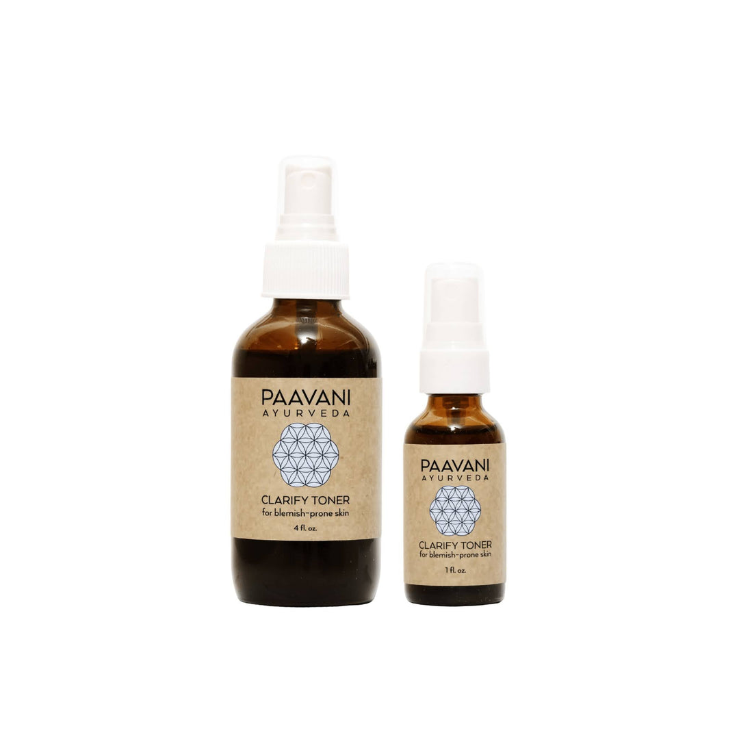 Clarify face toner with neem and rose in a clear glass bottle with a spray nozzle.