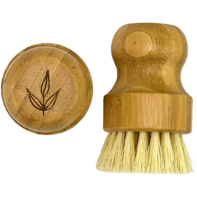 Bamboo pot brush with natural sisal bristles for cleaning cookware.
