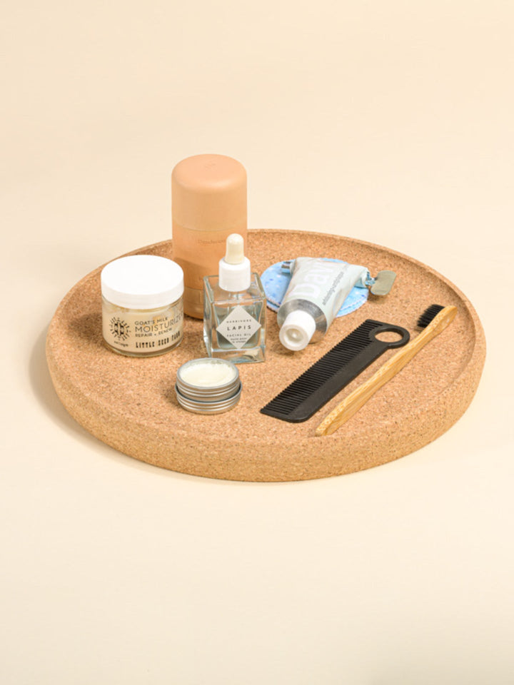 Round minimalist cork tray with a smooth, natural cork surface and simple design.