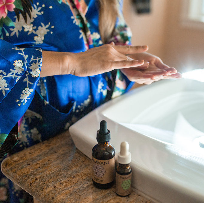 Vata Ayurvedic skincare ritual facial set with herbal products and tools.