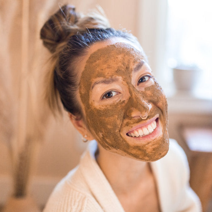 Vata Ayurvedic skincare ritual facial set with products, oils, and tools.
