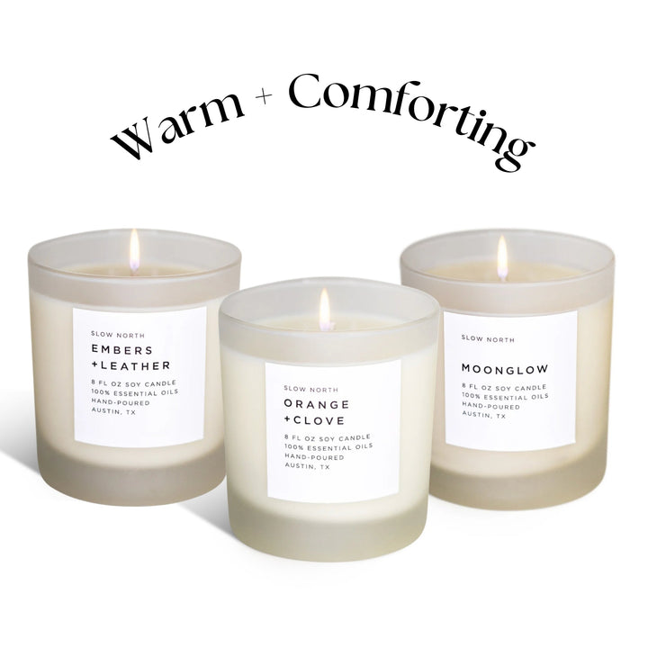 Warm Comforting Candle Trio with three essential oil soy candles in glass jars.