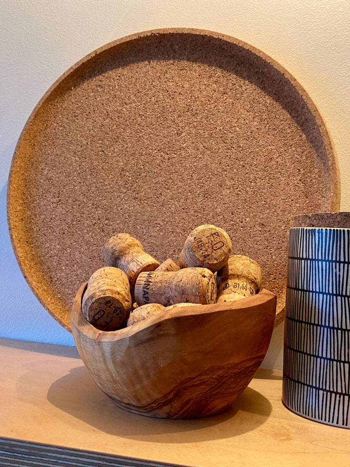 Round minimalist cork tray with a smooth natural cork surface, for serving or decor.