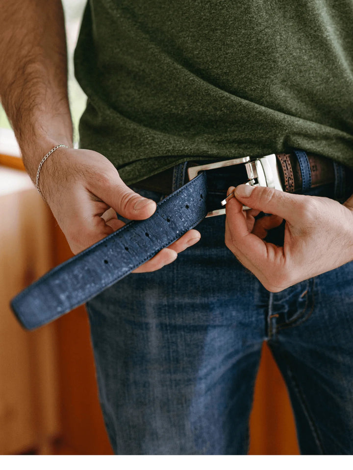 Reversible cork belt with brown and navy sides, a classic buckle, and textured cork finish.