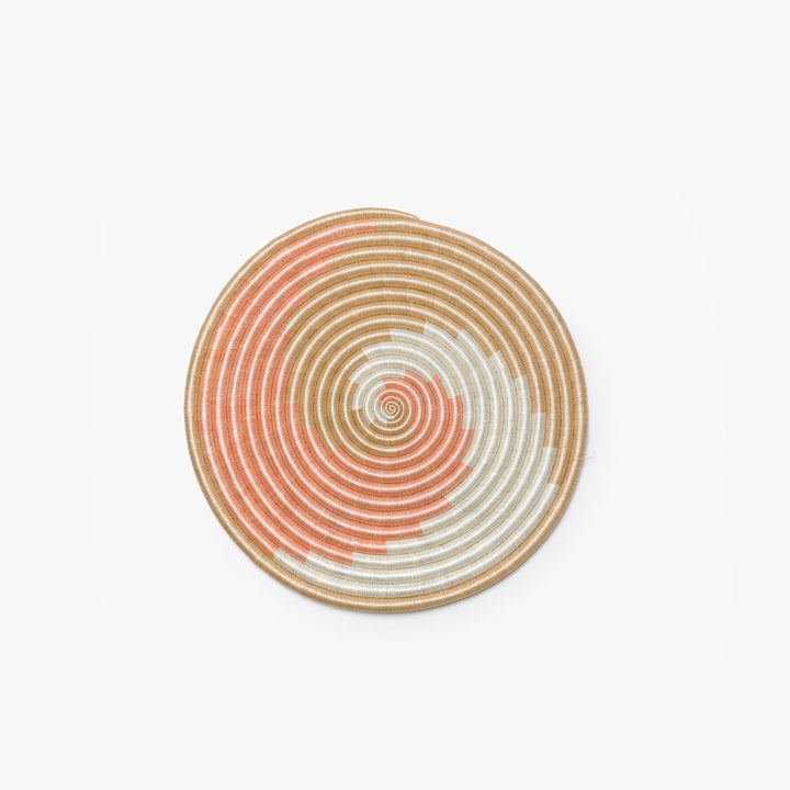 Small blush, white, and tea flat woven sisal wall hanging.