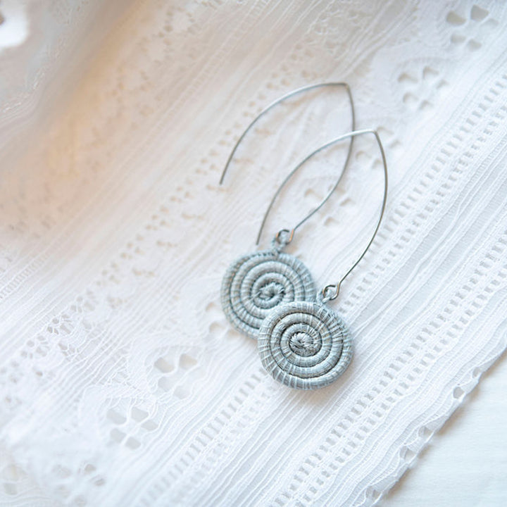 Ice blue hand-woven sisal earrings, lightweight with intricate weaving.
