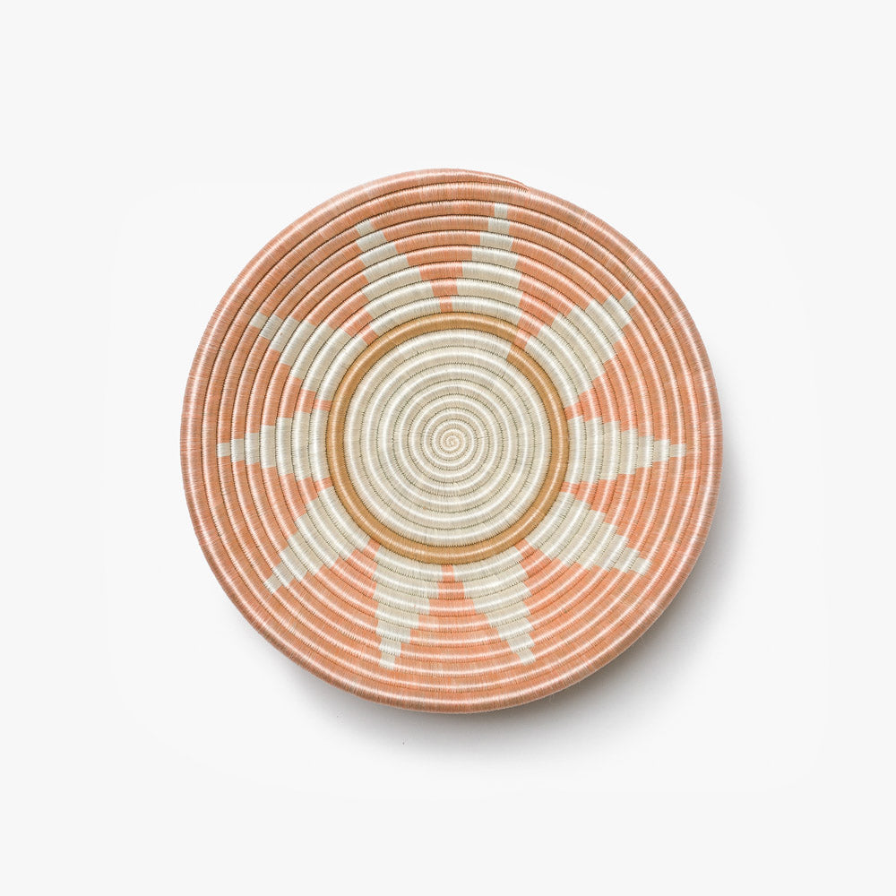 Medium Zuba woven bowl in blush sisal with a white sunburst star.