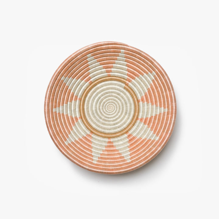 Medium Zuba woven bowl in blush sisal with a white sunburst star.