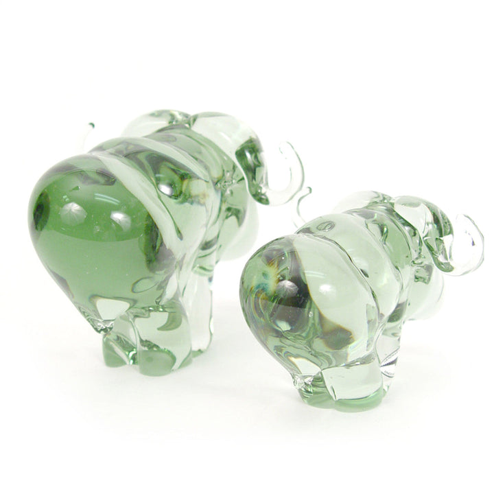 Recycled-glass buffalo figurine handblown from collected bottles.