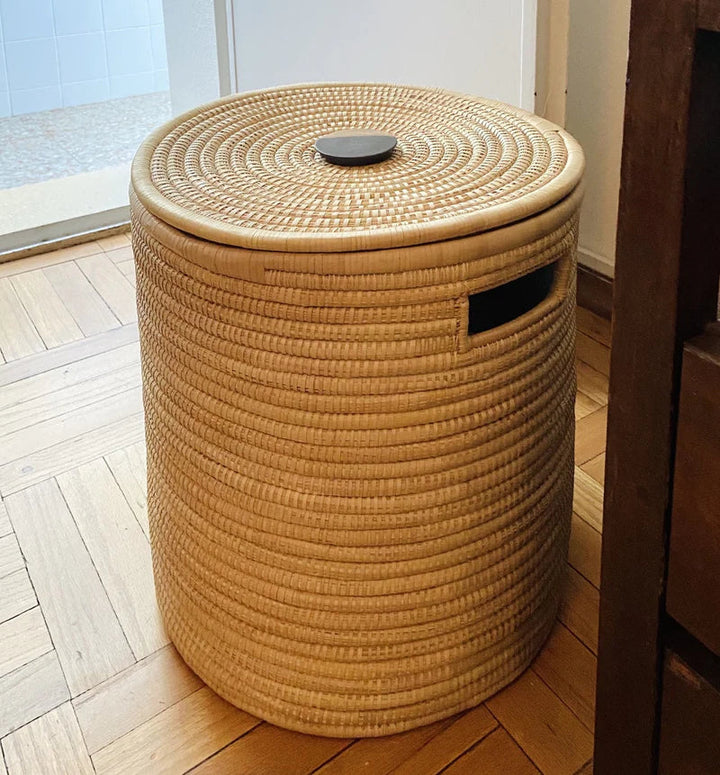 Natural Malawi palm basket with a mahogany wooden handle and woven design.