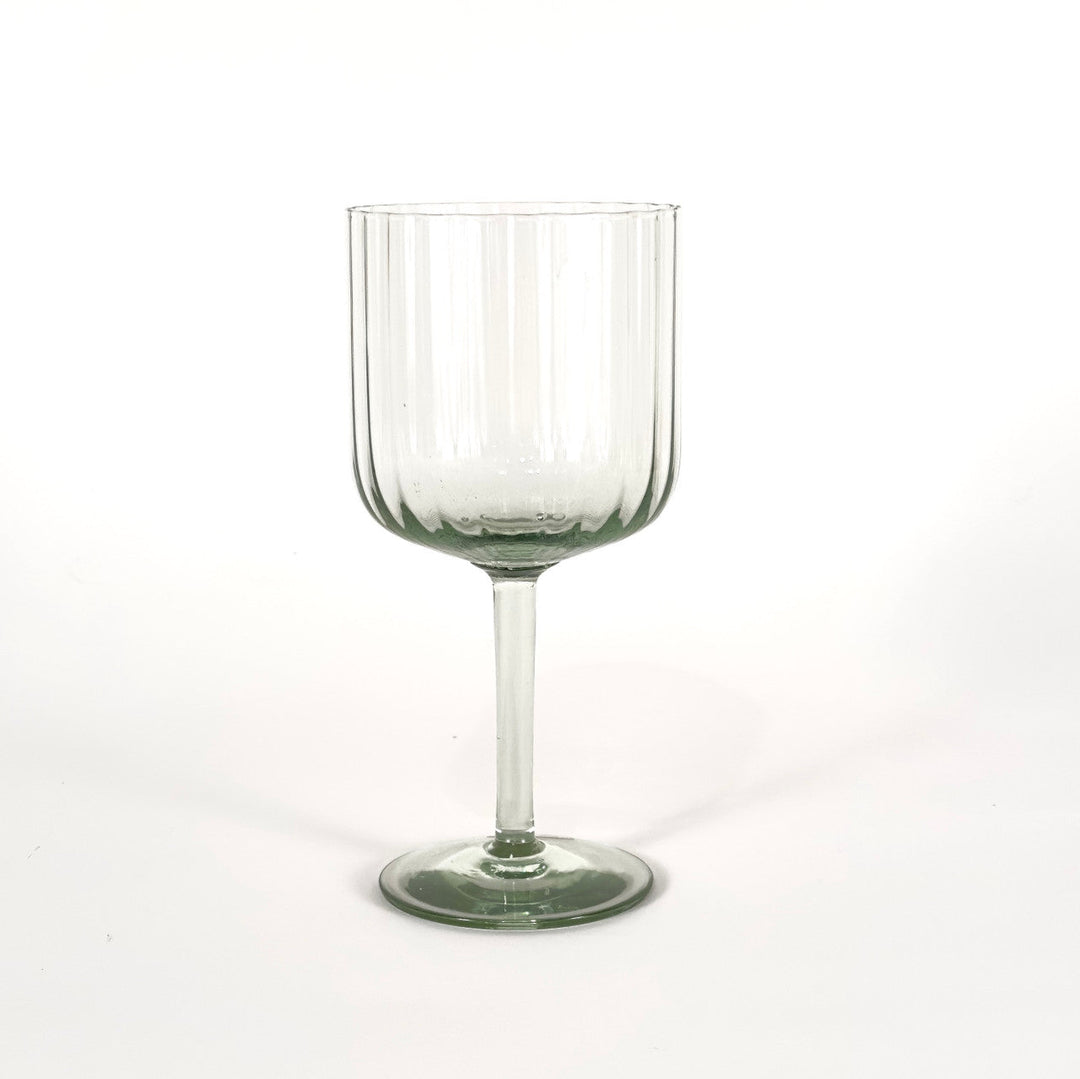 Hand-blown retro optic wine glass in recycled glass, with a light-catching optic texture, from Eswatini.