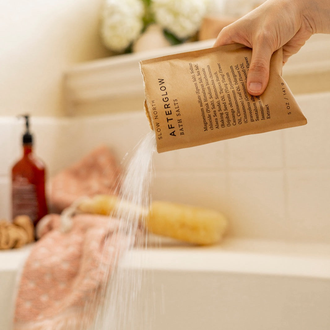 Bath salts pouch with floral packaging and colorful salt detail.
