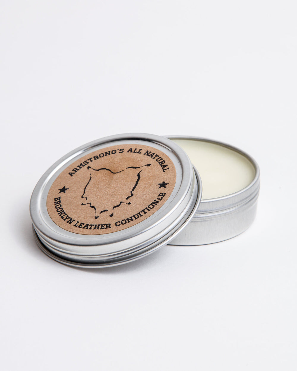 Brooklyn Leather Conditioner in a tin for nourishing and softening leather.