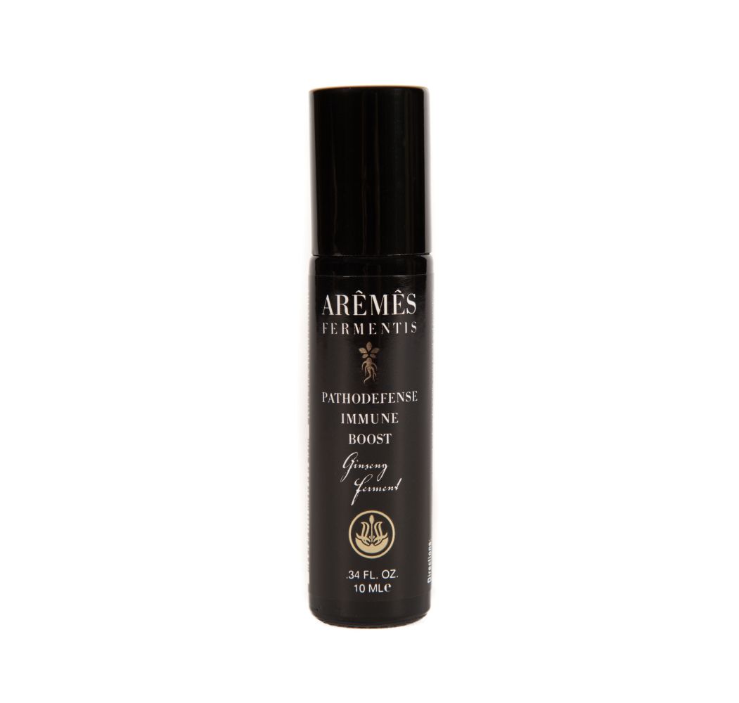 PathoDefense essential oil roll-on in a compact bottle.