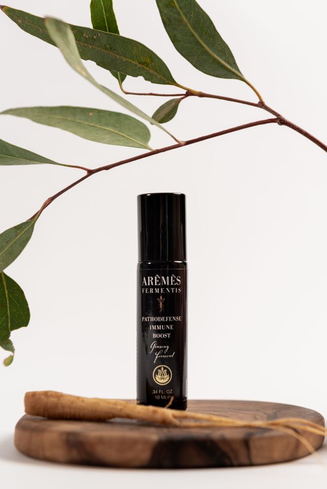 PathoDefense essential oil roll-on in a compact roll-on bottle.