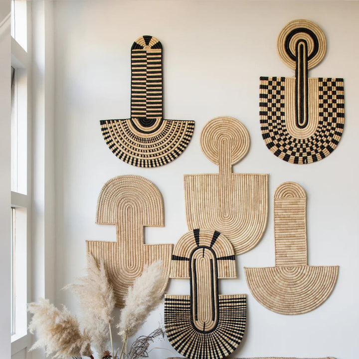 Handwoven natural-fiber abstract wall mask, stacked arched silhouette styled as modern wall decor.