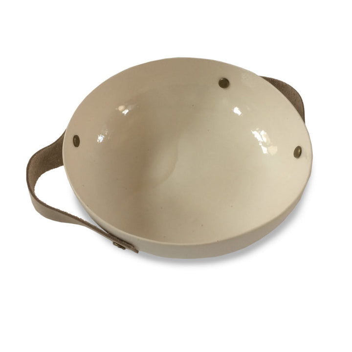 Handmade ceramic bowl with leather handles, smooth rounded shape with leather accents.