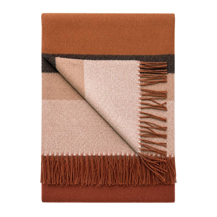 Handwoven baby alpaca throw blanket in russet, 51 by 71 inches with a brushed finish.
