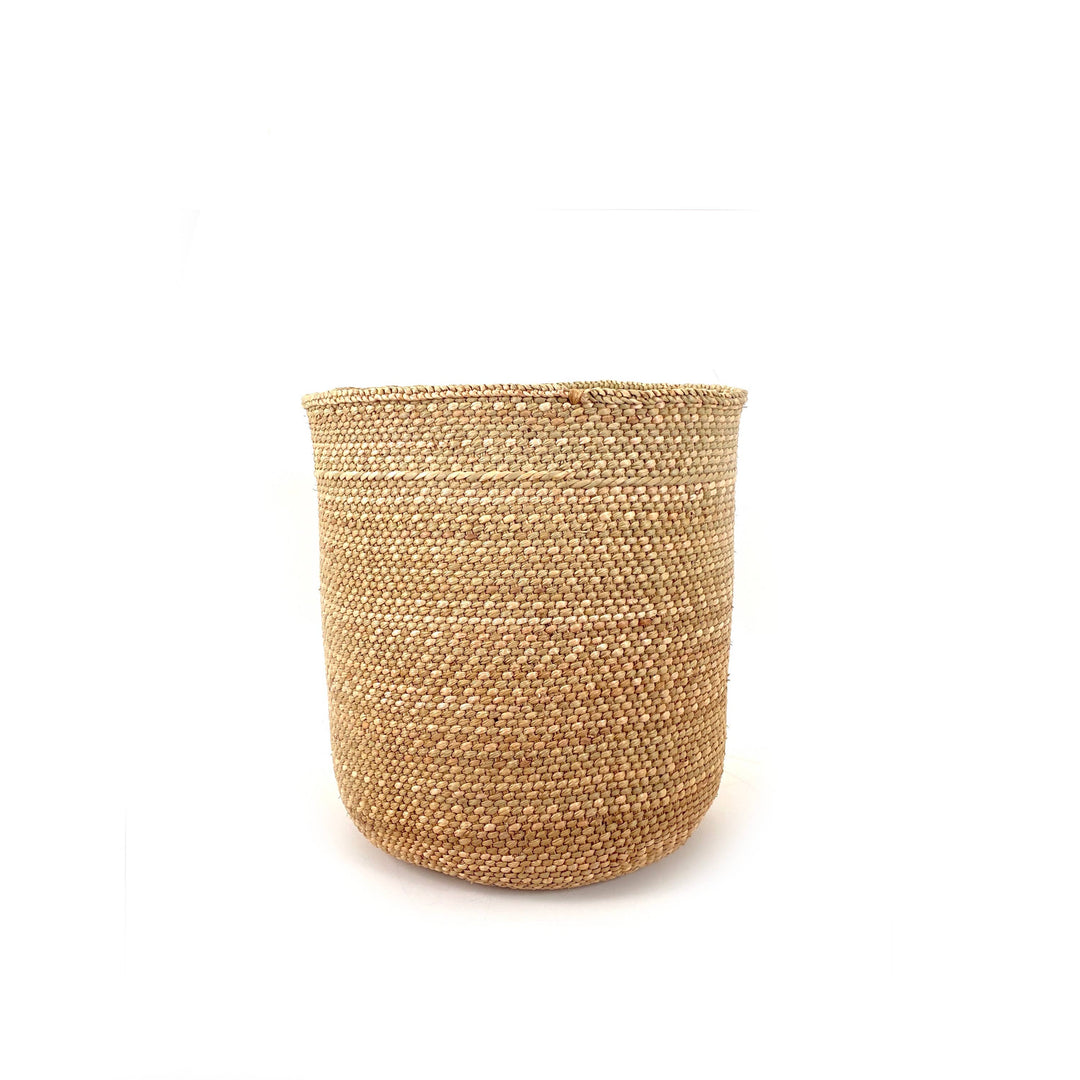 Natural Iringa grass basket shown from above, coiled base and plaited rim visible