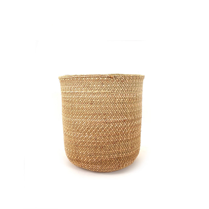 Natural Iringa grass basket shown from above, coiled base and plaited rim visible