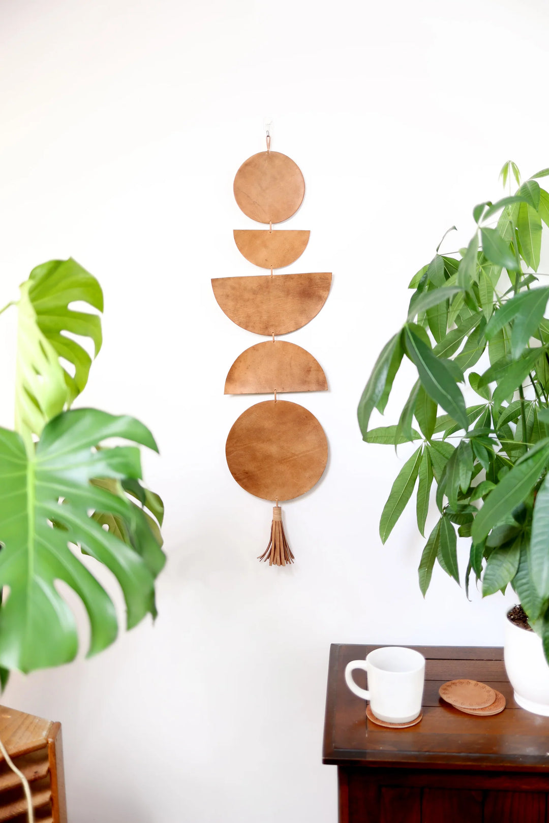 Large leather Luna moon-phase wall hanging with a hand-cut moon-phase design.