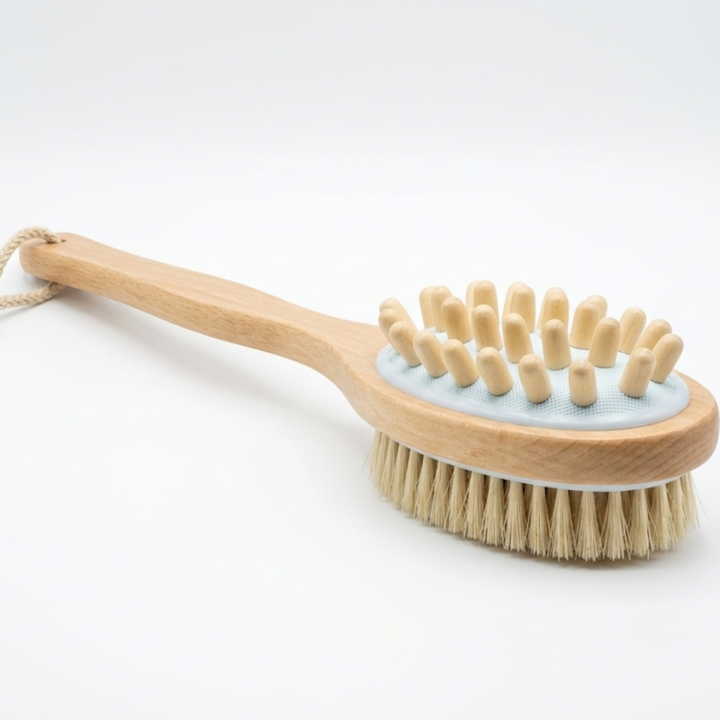 Natural boar bristle bath brush with long handle for gentle exfoliation and cleansing during bathing.