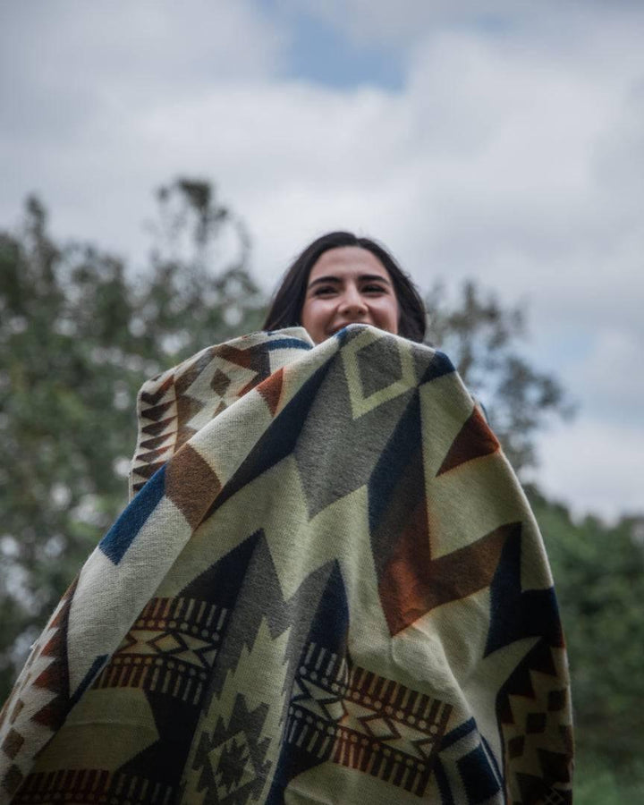 Beyond Borders Collective Awa Earth blanket, Andean geometric in earth tones.