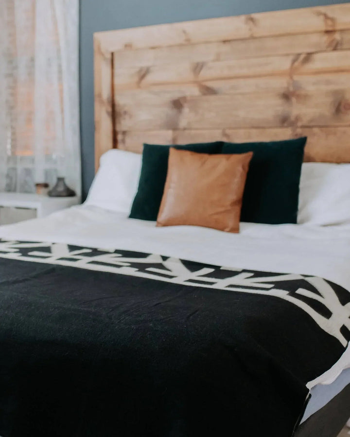 Minimalist black and cream Destino blanket, 92 by 78 inches, made in Ecuador.
