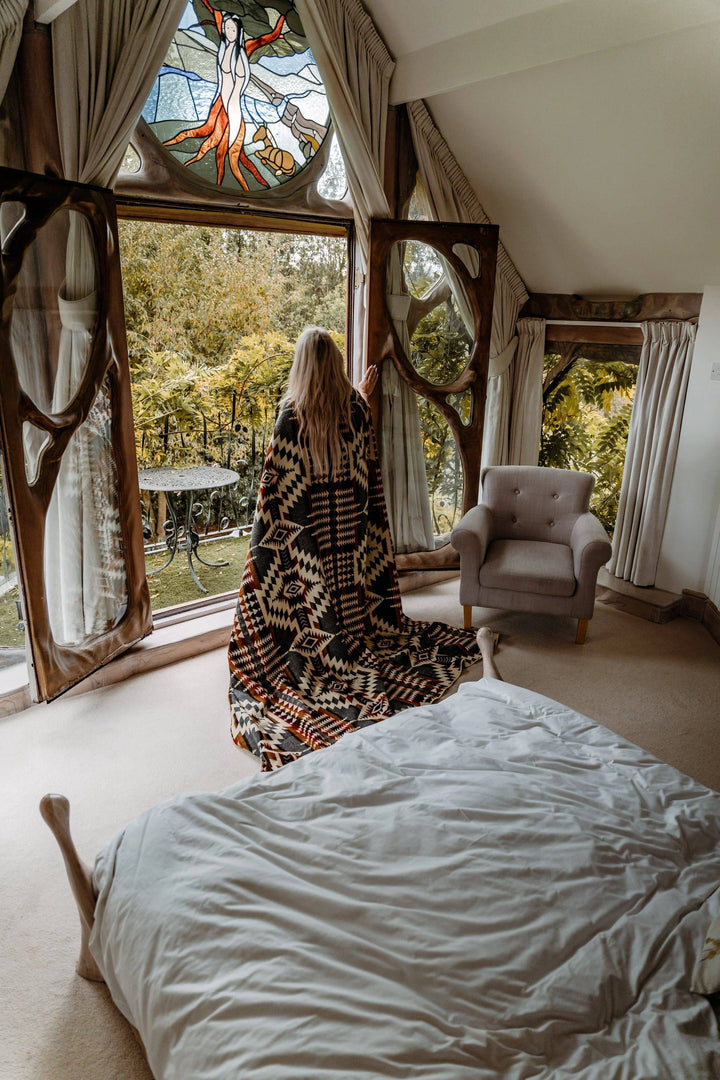 Campfire Ash fringed throw folded, showing the geometric pattern.