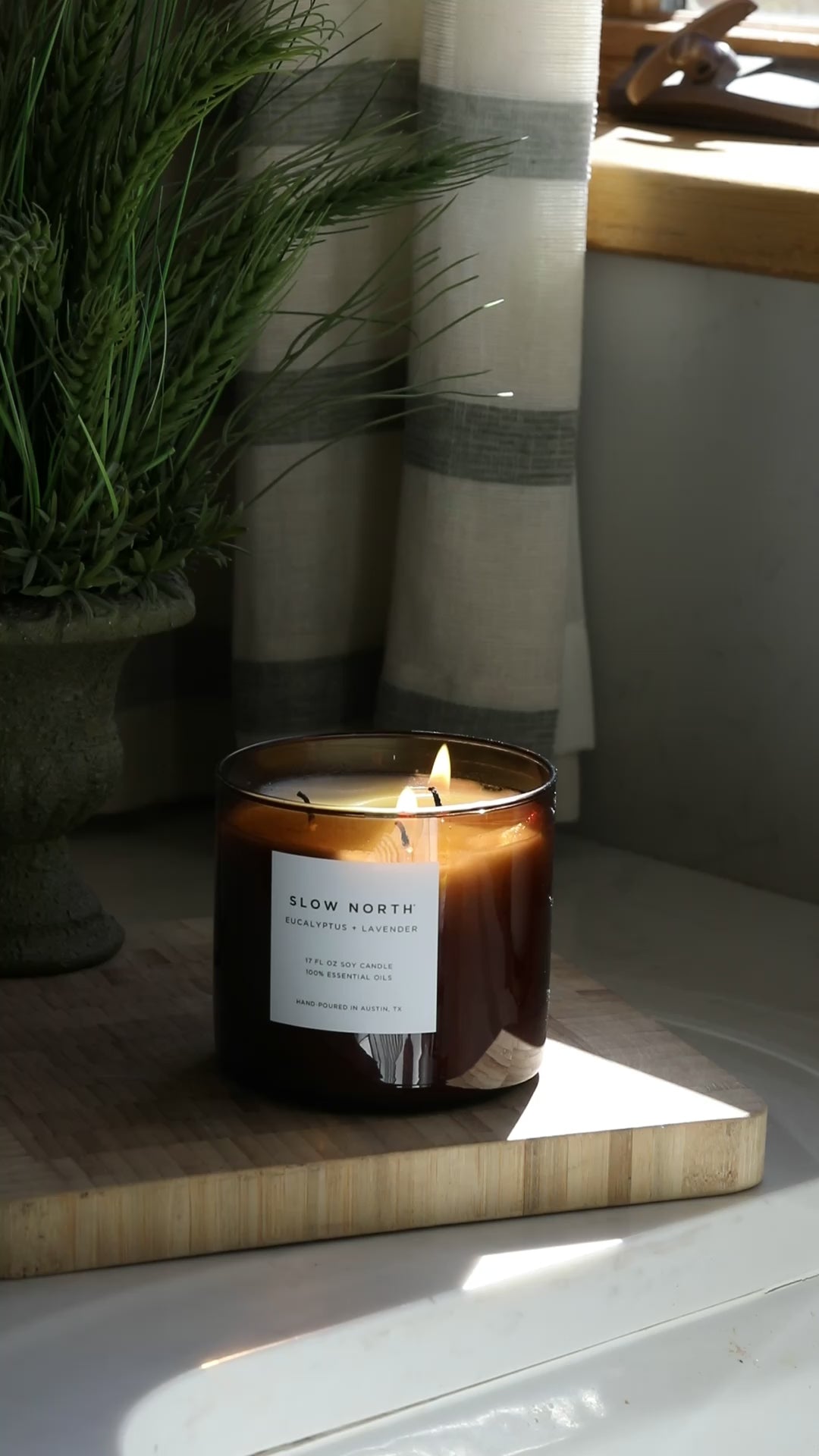 Eucalyptus Lavender three-wick candle with a calming floral scent.