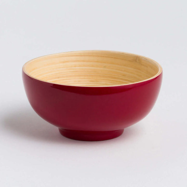 Handcrafted bamboo dining bowl with natural grain and a rounded shape.