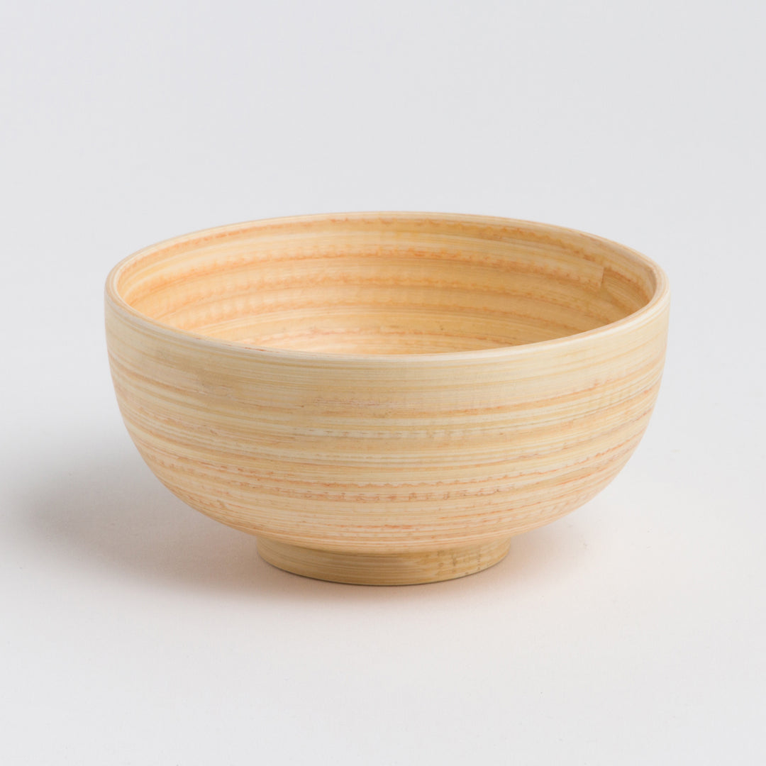 Handcrafted bamboo dining bowl with a smooth surface and round shape.
