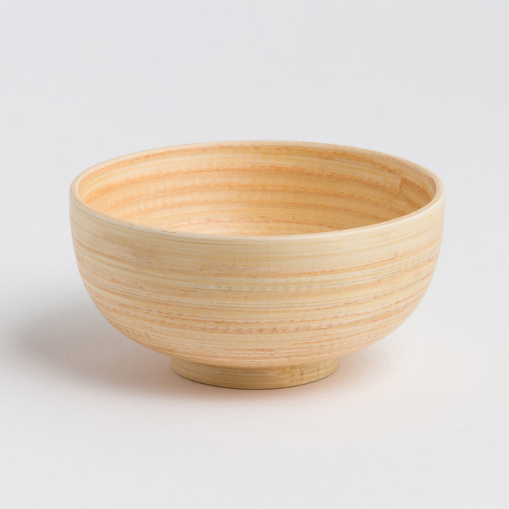 Handcrafted bamboo dining bowl with a smooth surface and round shape.