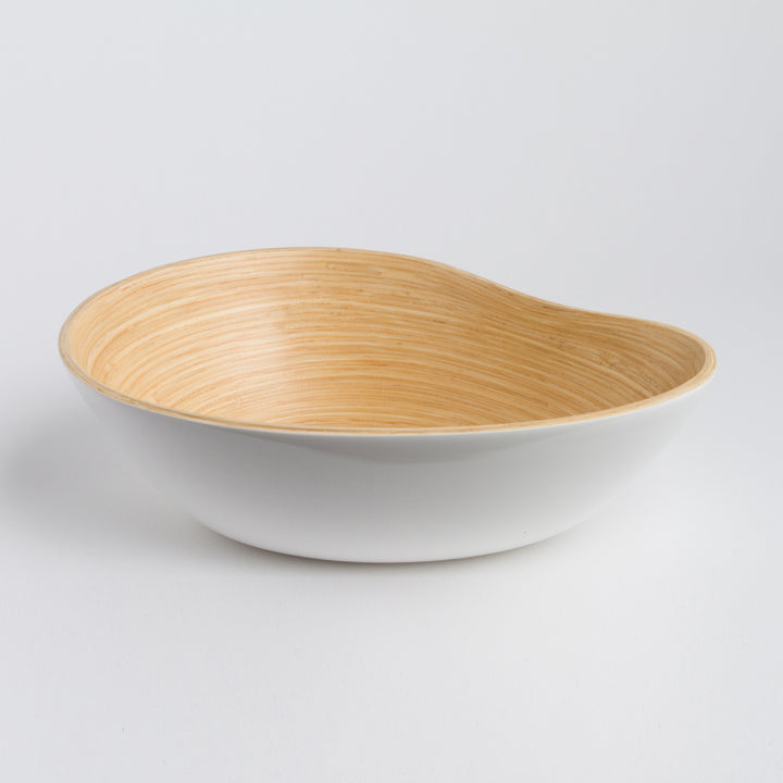 Bamboo serving bowl shaped like a mango, with a smooth finish.