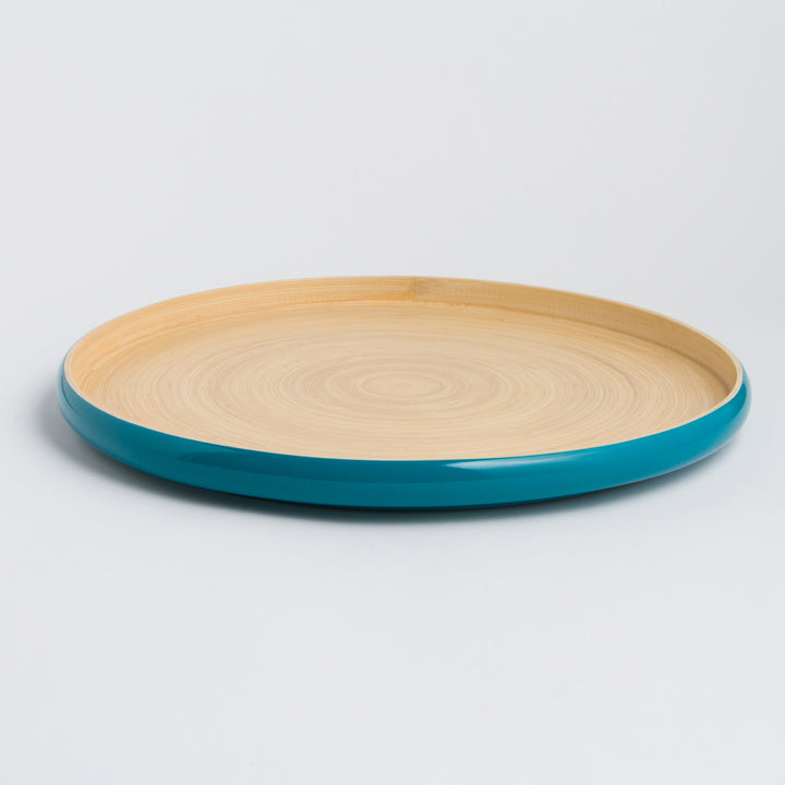 Handcrafted round bamboo tray with a smooth natural surface.
