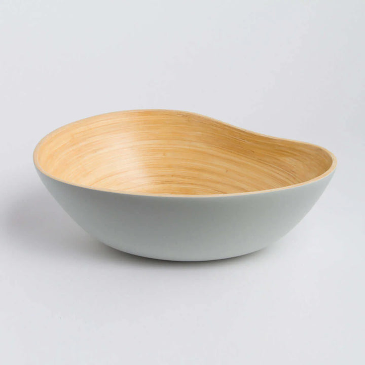 Bamboo serving bowl shaped like a mango, with a smooth finish.