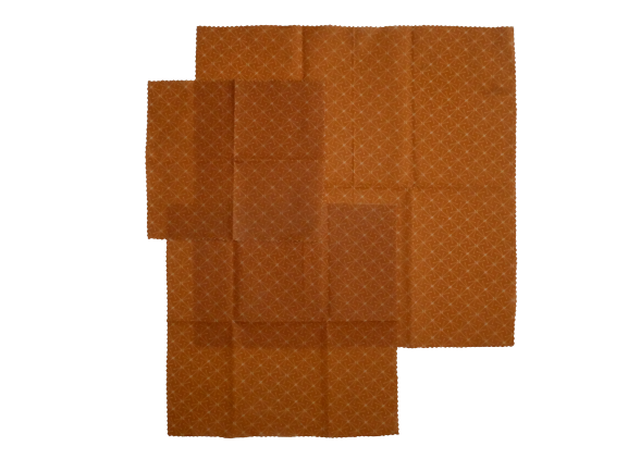 Reusable organic beeswax food wraps with colorful patterns.