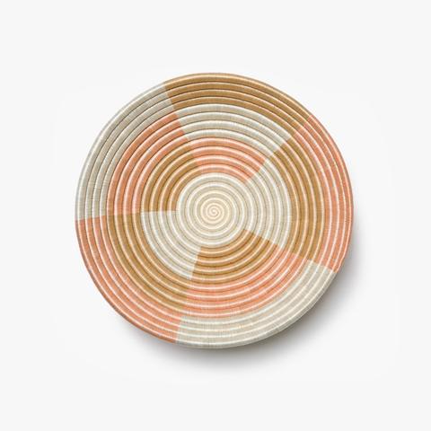 Medium Staccato woven bowl in blush with a quarter-pinwheel pattern.