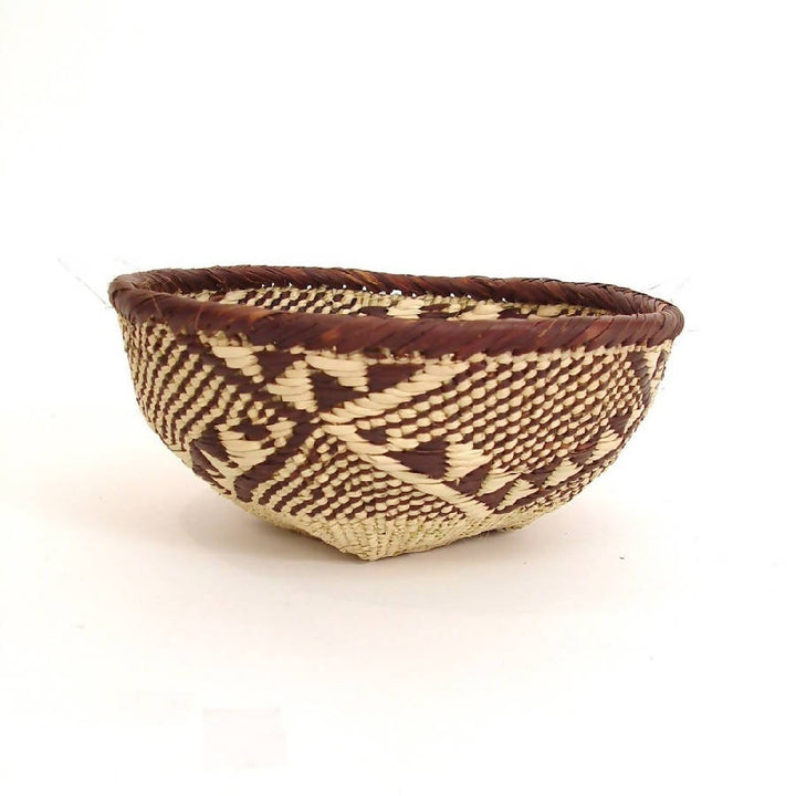 Handwoven Tonga basket bowls, natural fiber with an intricate weave for storage.