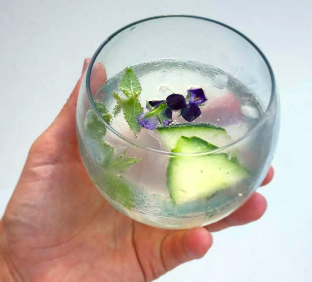Round recycled glass whiskey tumbler with a smooth, rounded shape.
