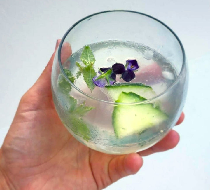 Round recycled glass whiskey tumbler with a smooth, rounded shape.