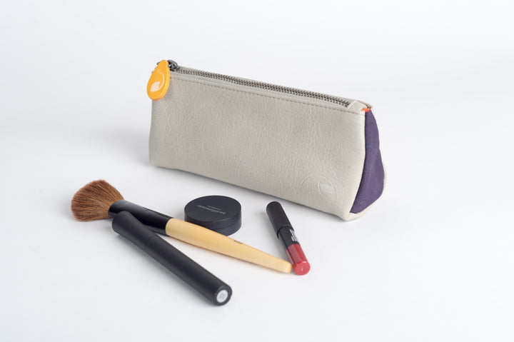 Vegan leather Union makeup pouch, a compact case with a zipper closure.