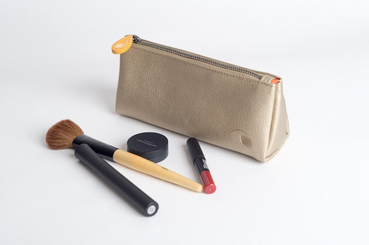 Vegan leather Union makeup pouch with a compact shape and zipper closure.