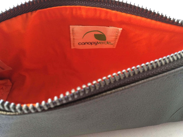 Vegan leather Union makeup pouch with a compact, stylish shape.